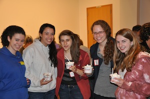 Teens are all smiles eating ice cream at the event