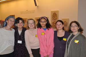 Gateways staff Rina Hoffman and Sherry Grossman pose with one of their teen madrichim and some synagogue staff